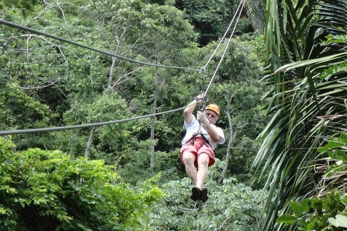a woman on a zip line in the jungle