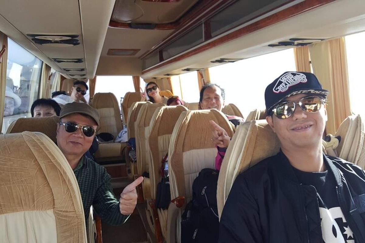 a group of people sitting on a bus