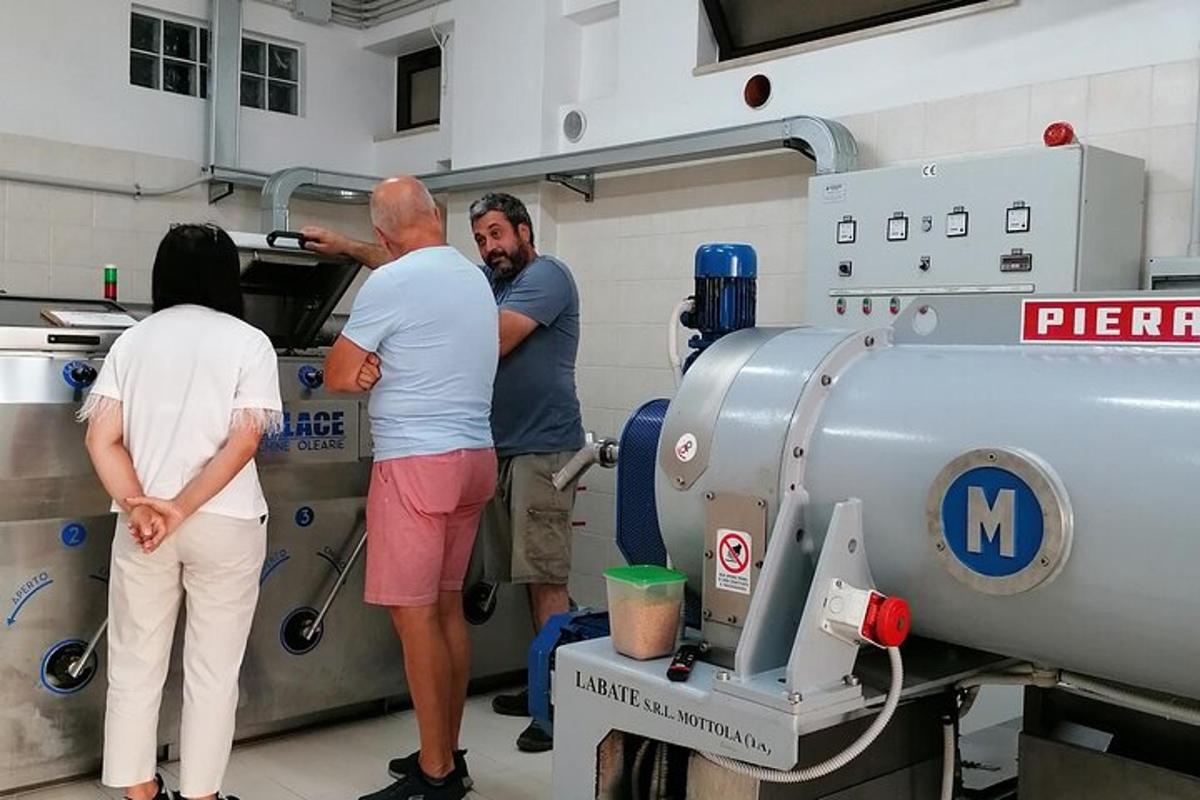 a group of people standing around a machine