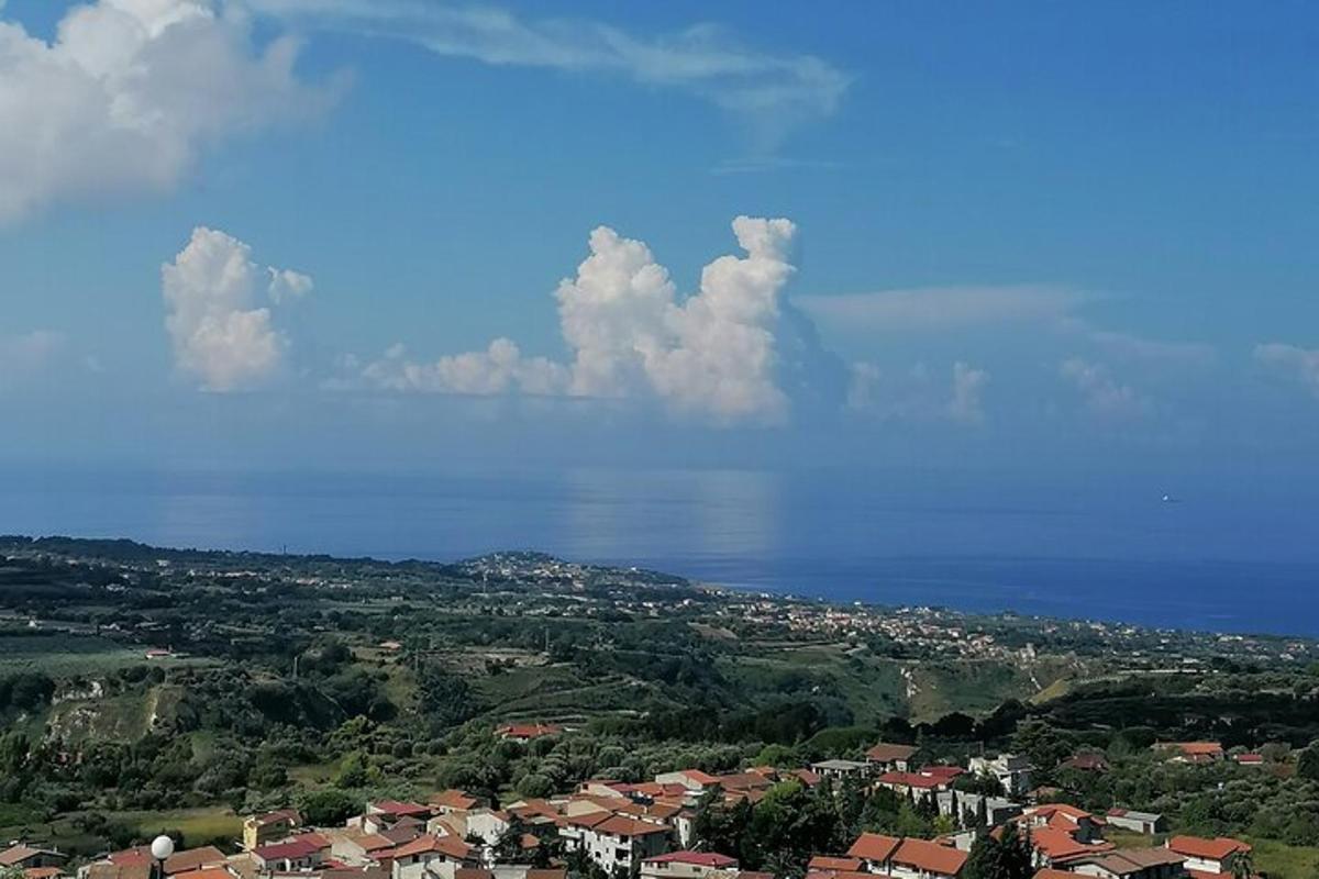 a view of a city and the water with clouds