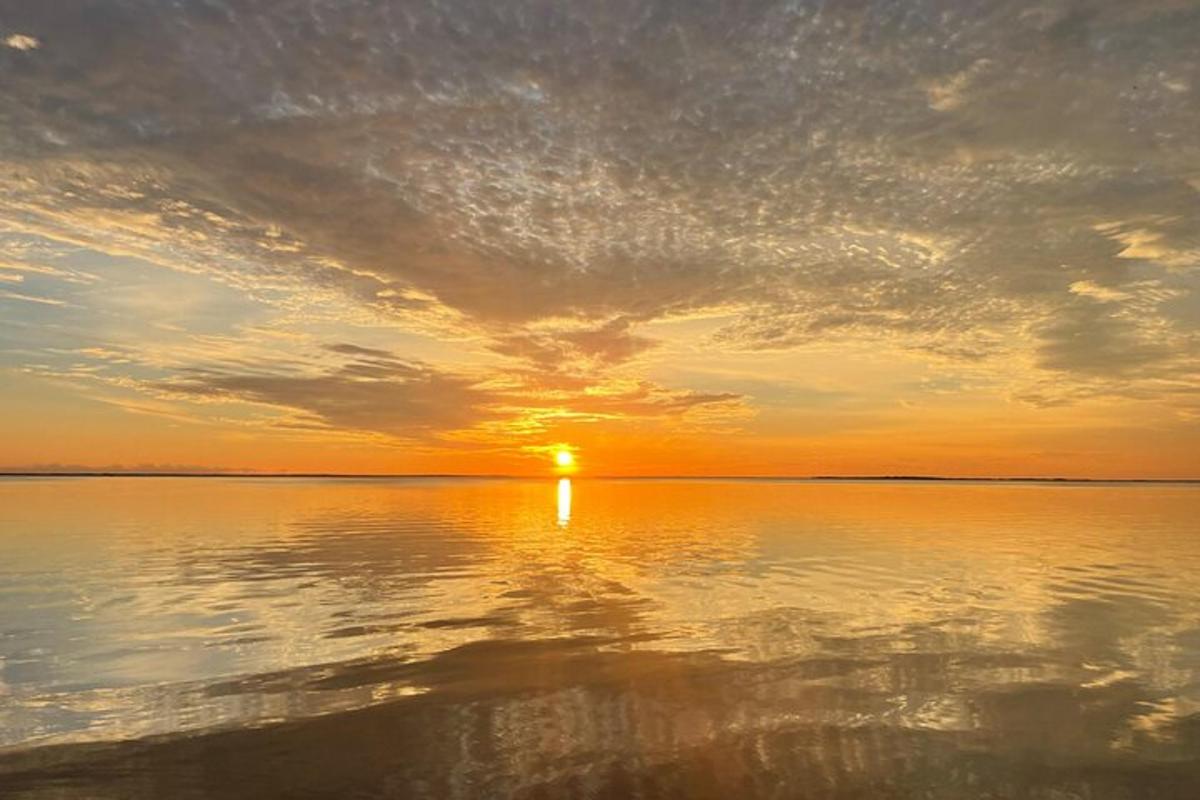 a sunset over a large body of water