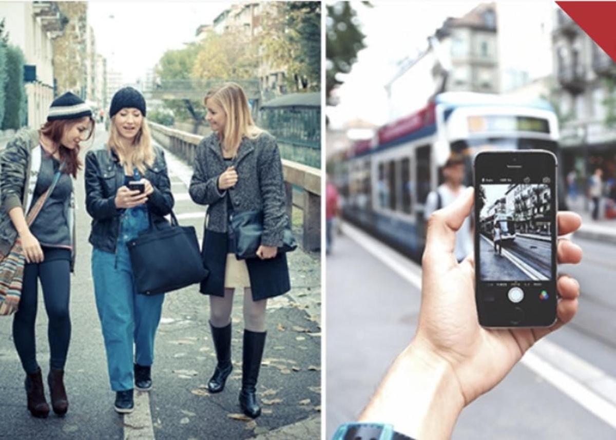 a person taking a picture of two women with a cell phone