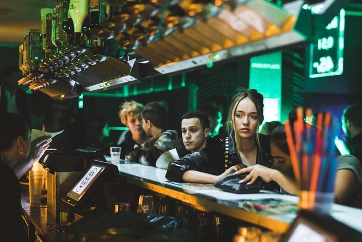 a group of people sitting at a bar