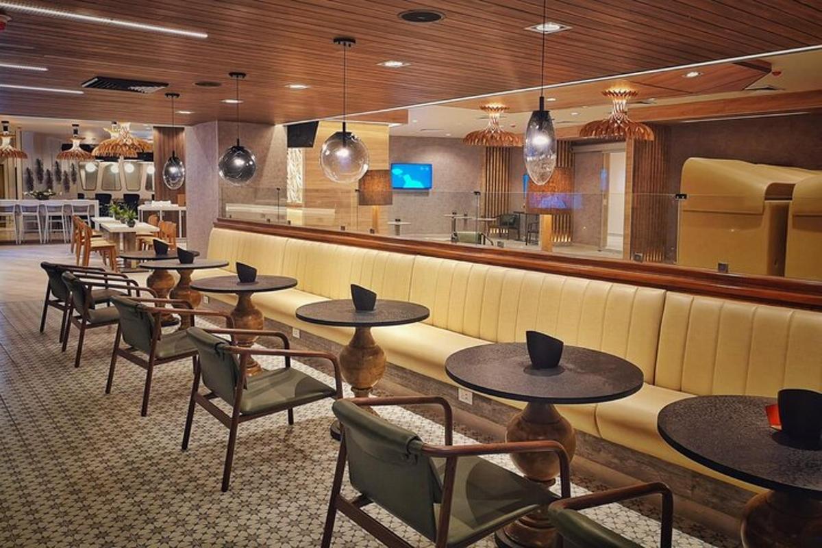a restaurant with tables and chairs and a bar