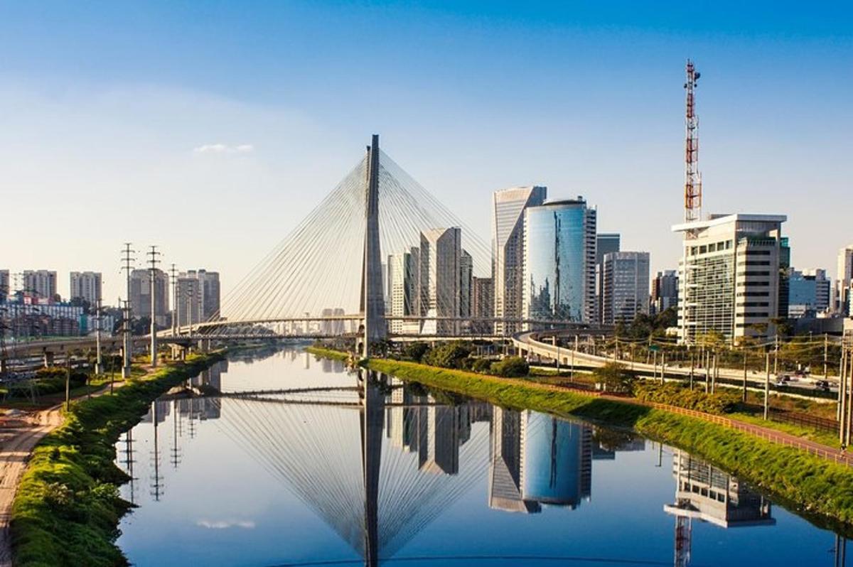 a bridge over a river in front of a city