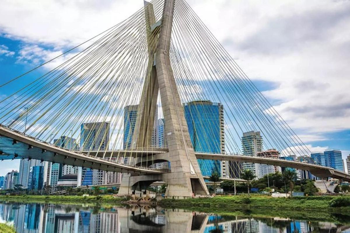 a bridge over a body of water with buildings