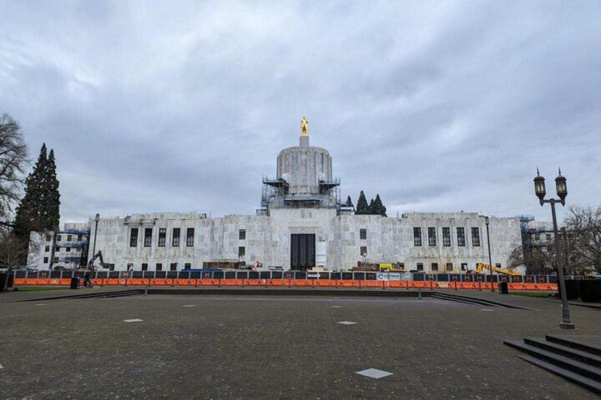 a large white building with a gold dome on top