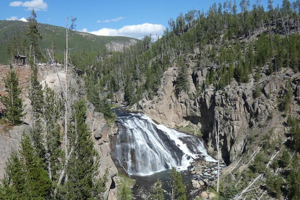 a waterfall on the side of a rocky mountain