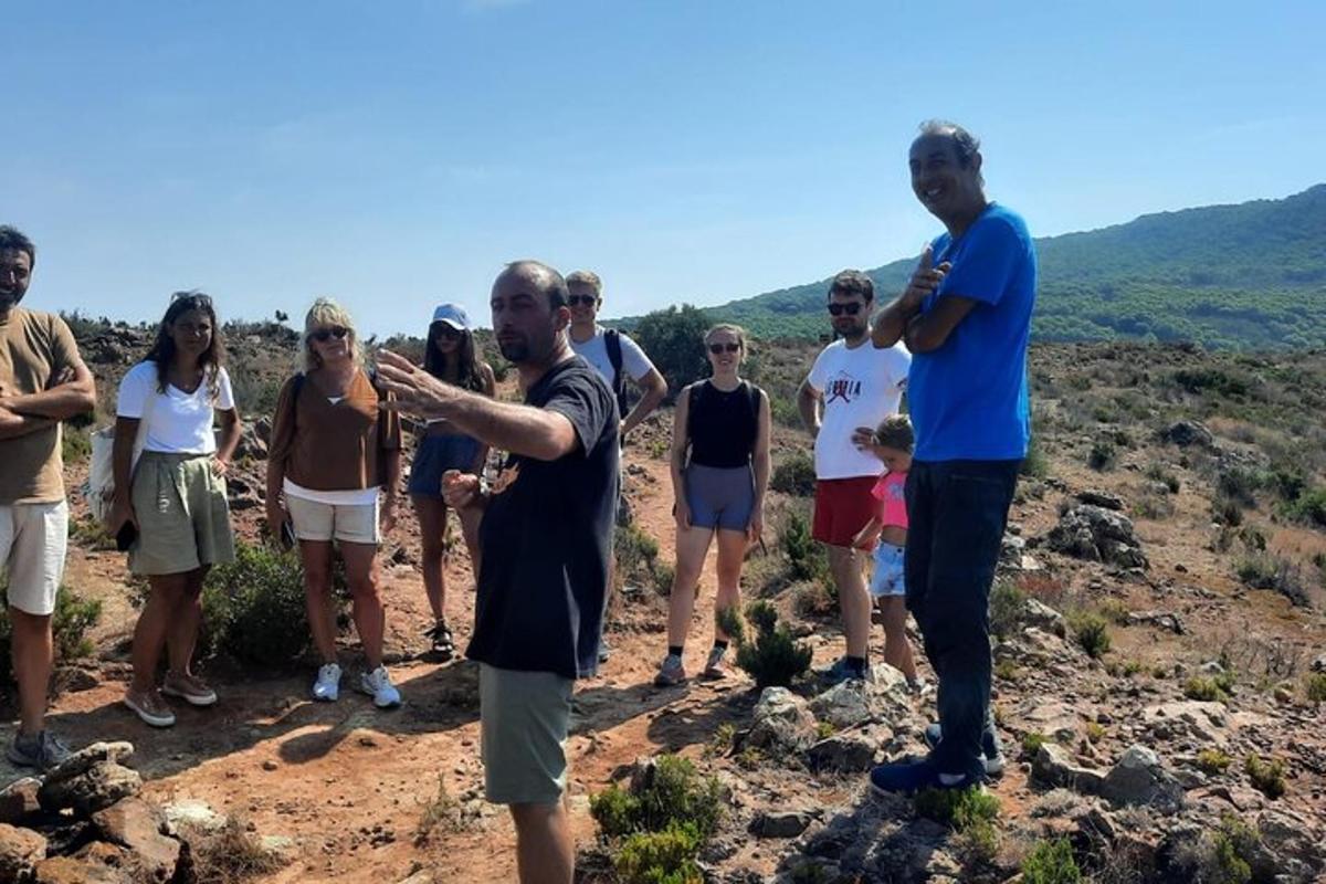a group of people standing on top of a hill
