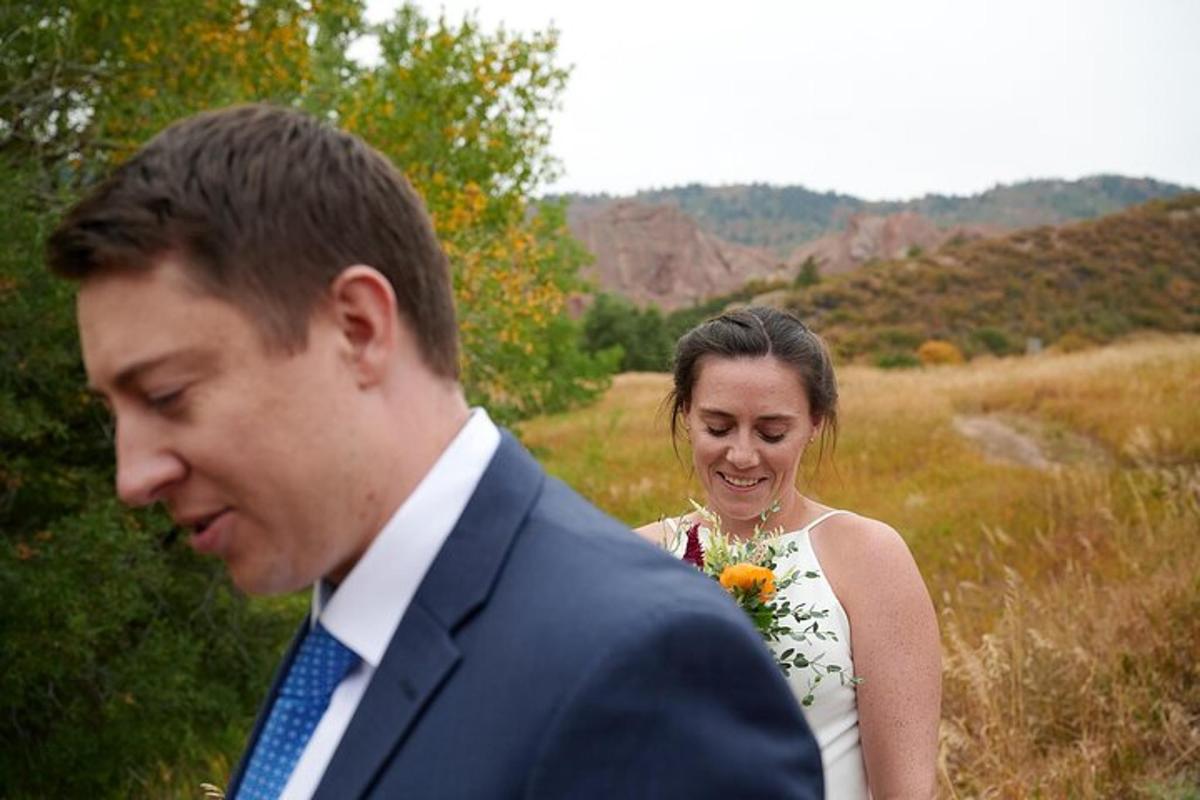a man and a woman standing in a field