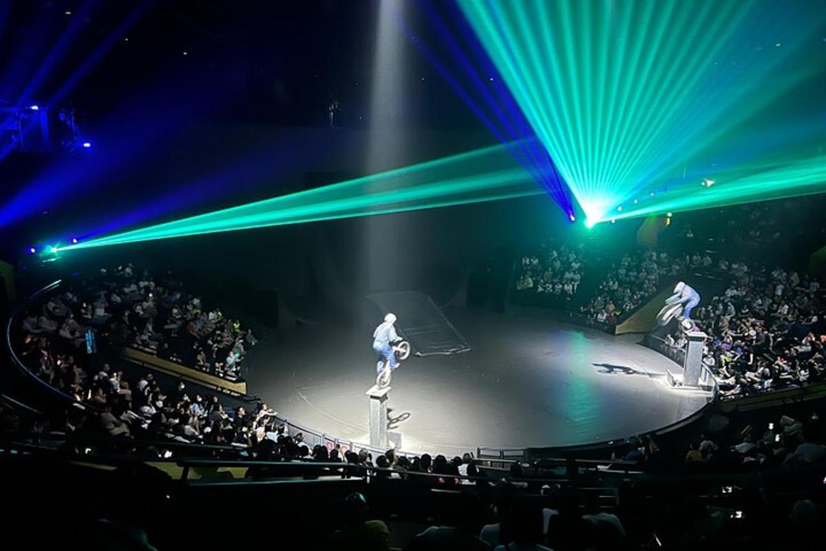 a man standing on a stage in front of a crowd