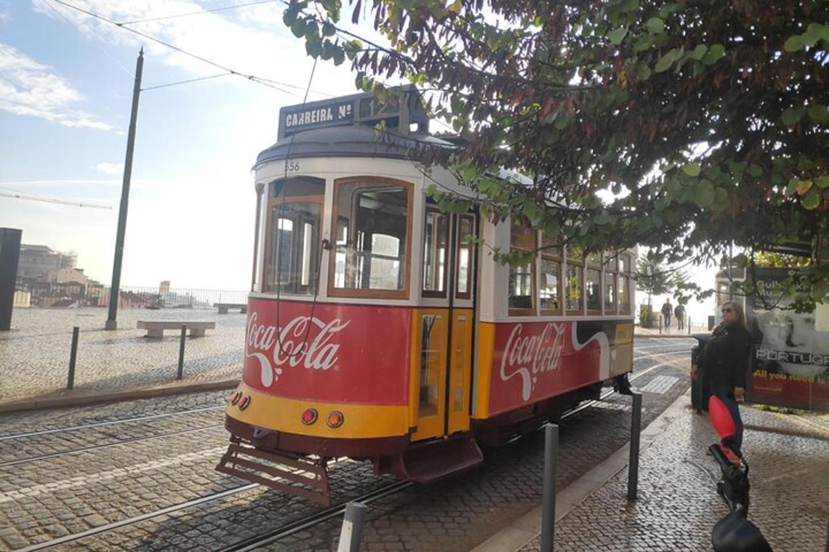 a coca cola trolley car on the tracks