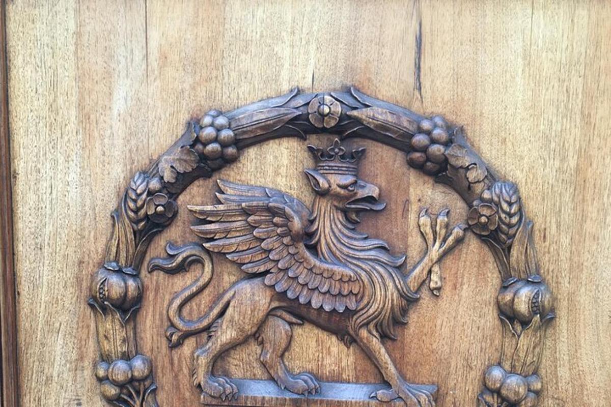 a wooden door with aoster on a wooden wall