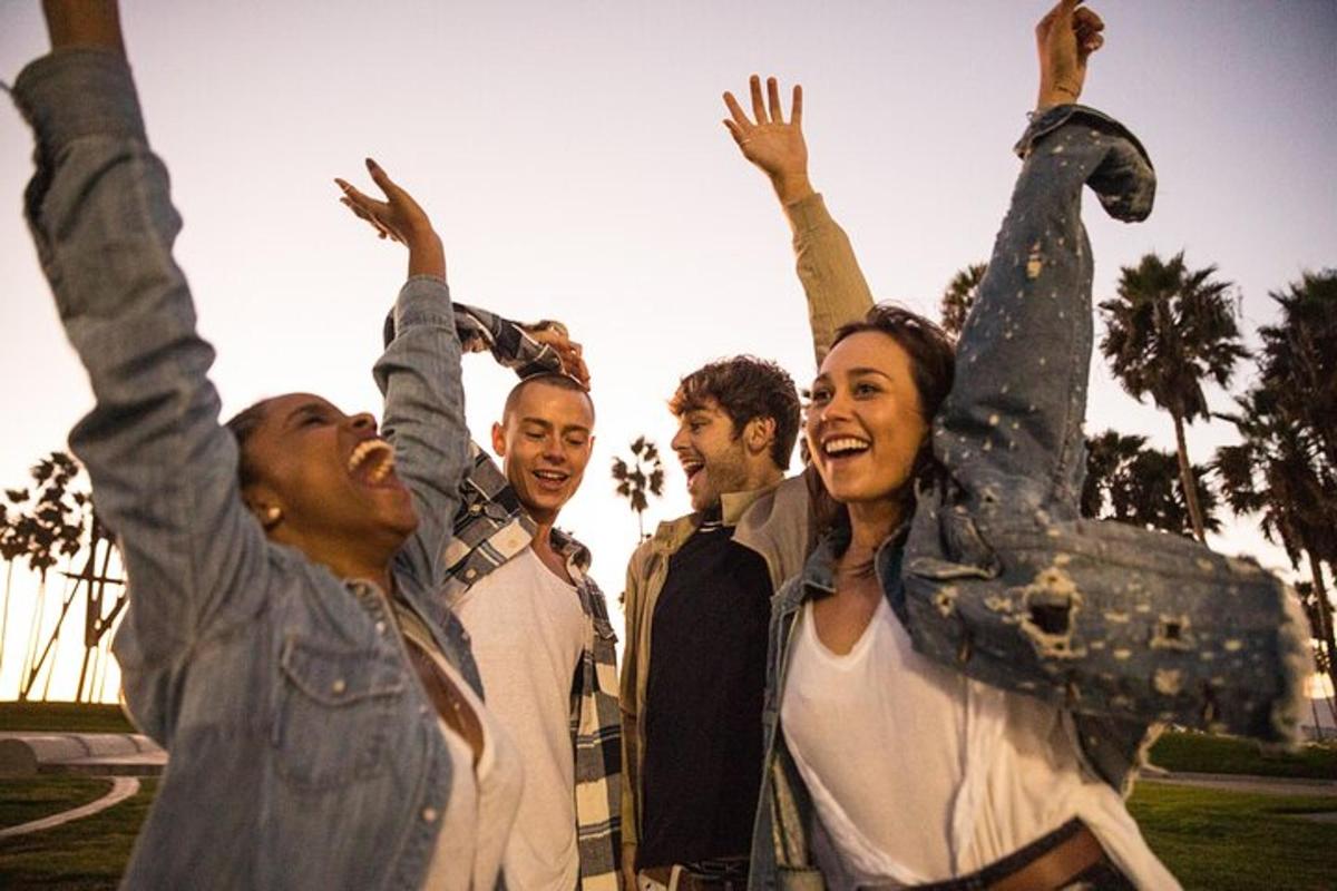 a group of people with their arms in the air