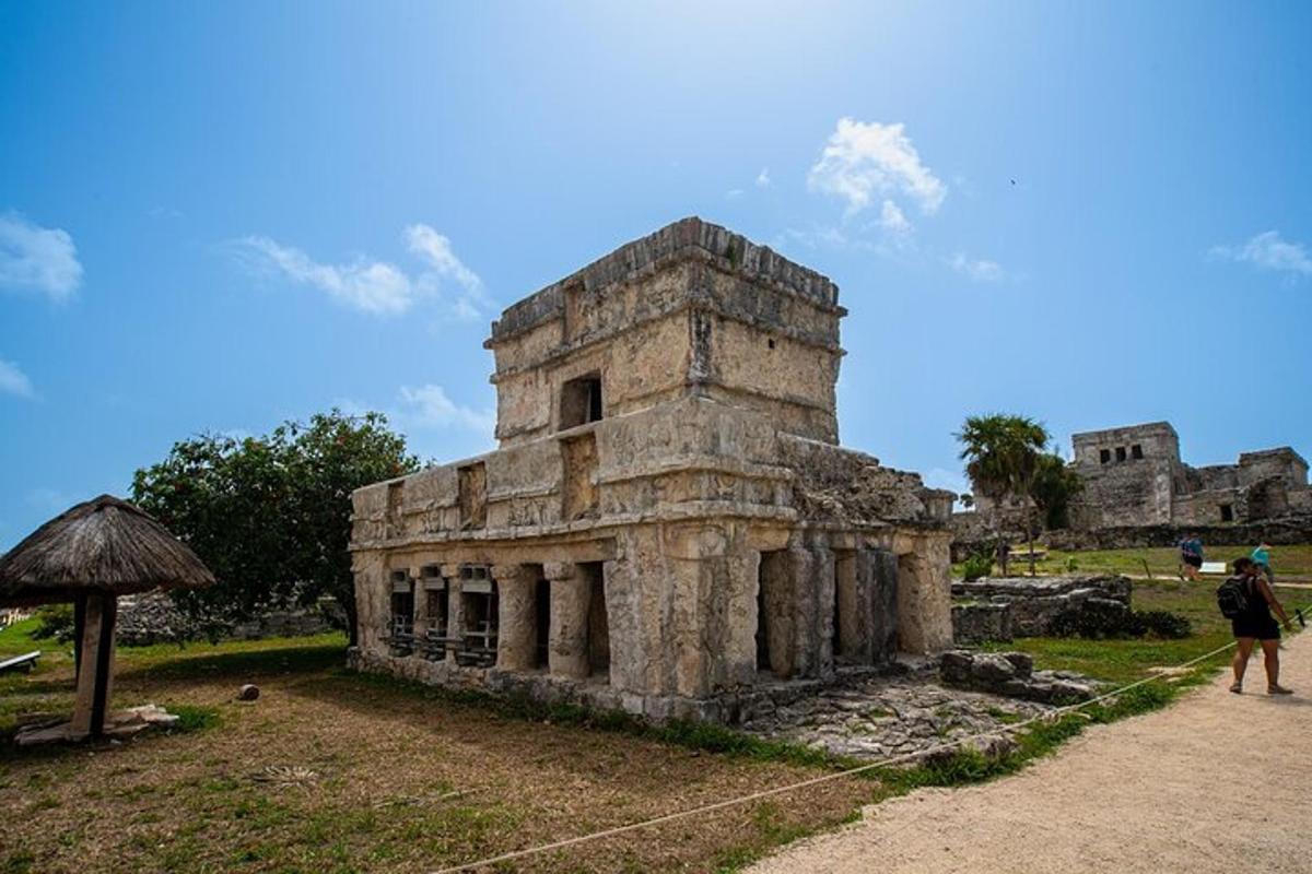 an old building with a person standing in front of it