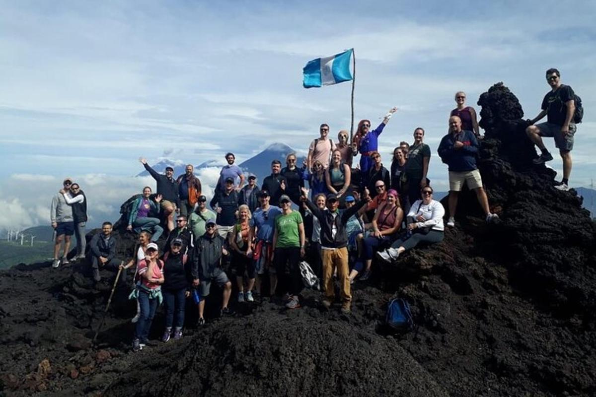 a group of people standing on top of a mountain