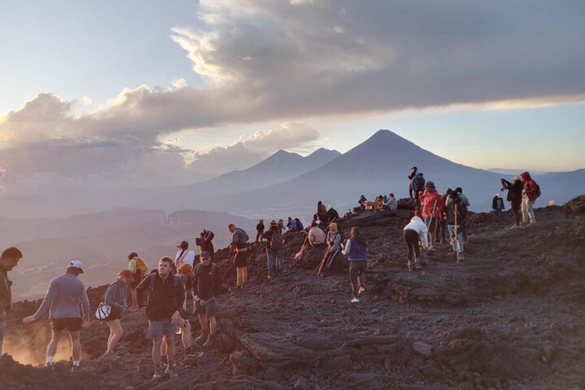 a group of people standing on top of a mountain