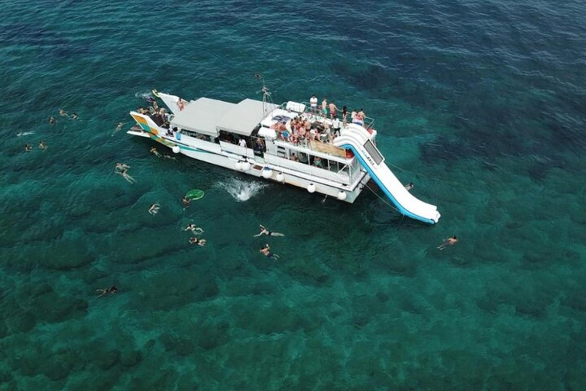 a group of people on a boat in the water
