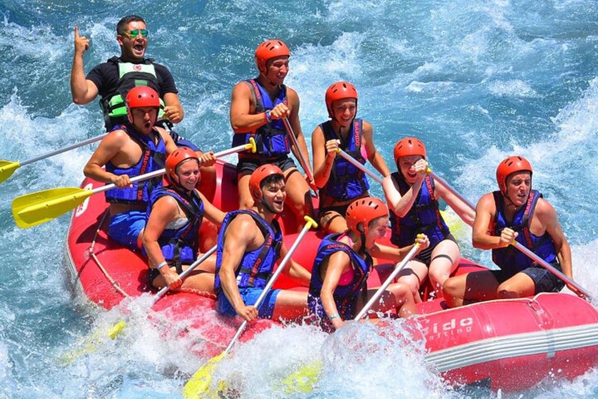 a group of people on a raft in the water