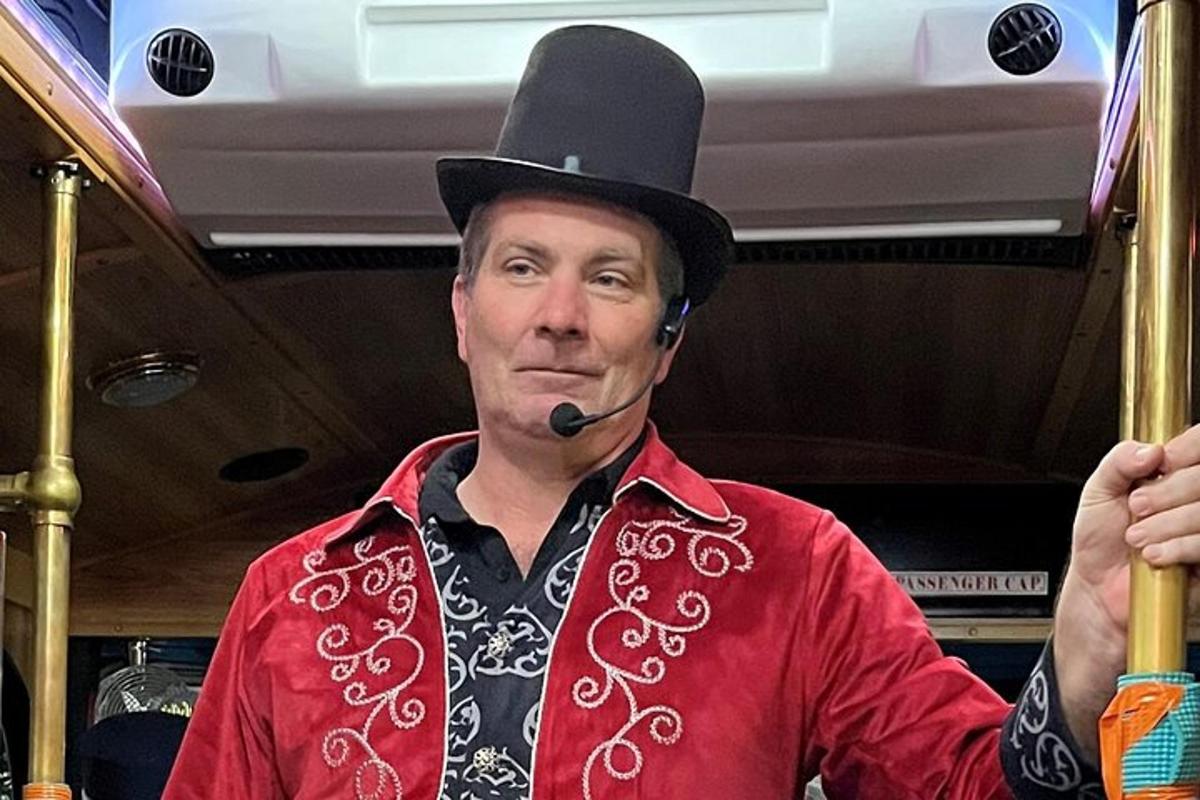 a man wearing a top hat with a pipe