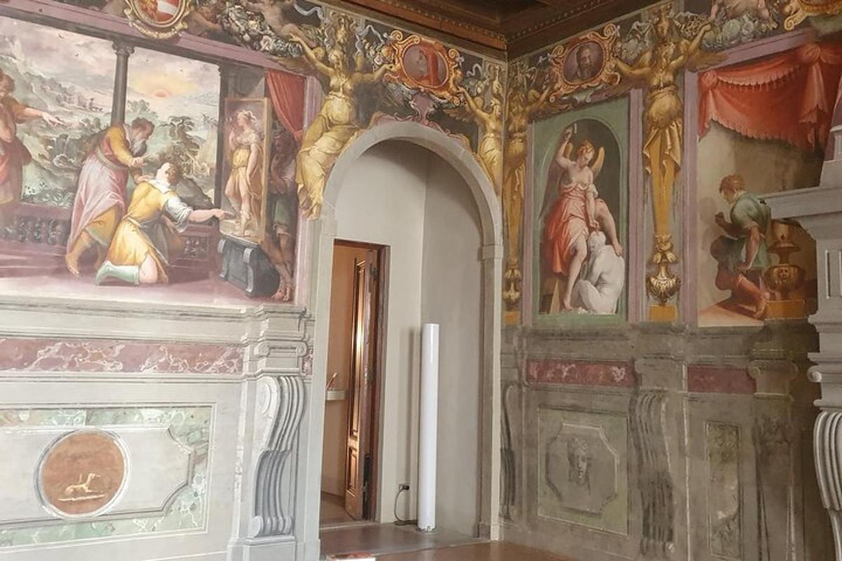 a room with paintings on the walls of a building