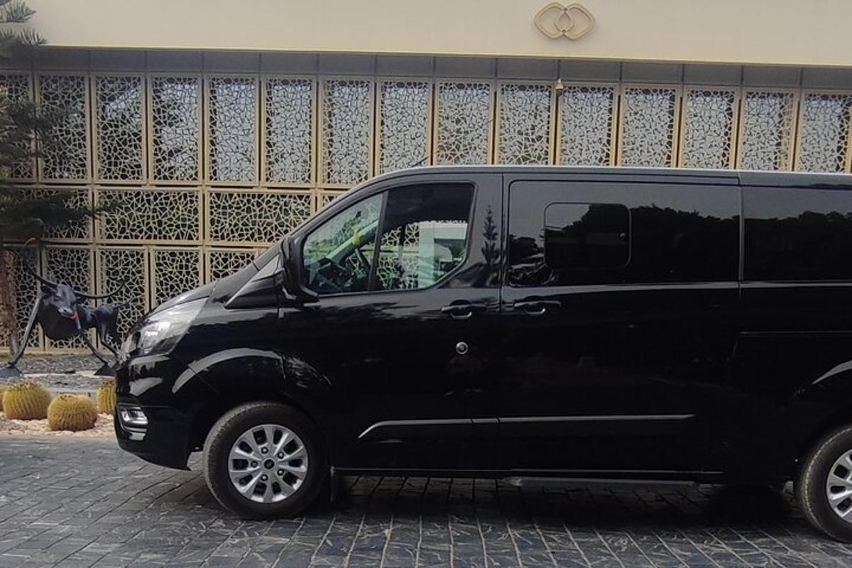 a black van parked in front of a building