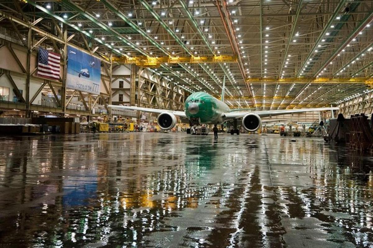 an airplane parked in a hanger in a building