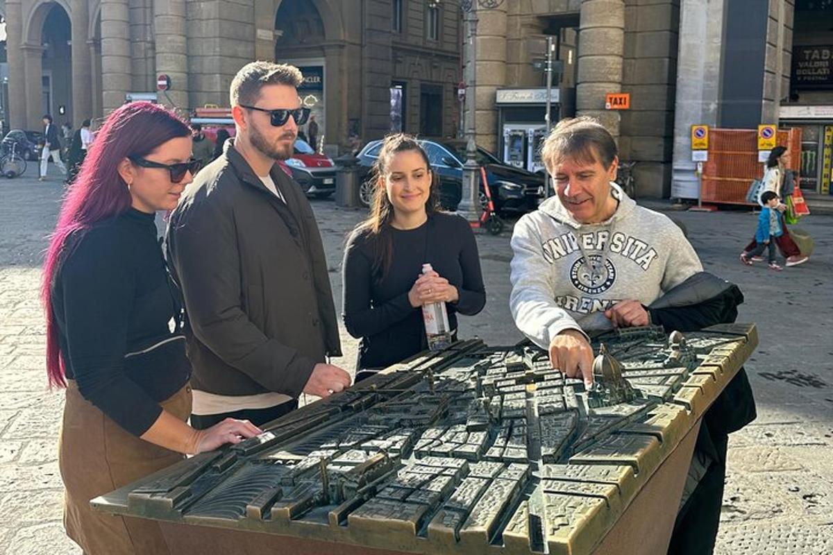 hópur fólks stendur við borð með búri