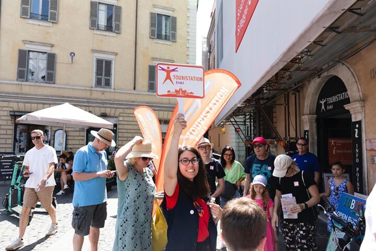 a woman holding up a sign in a crowd of people