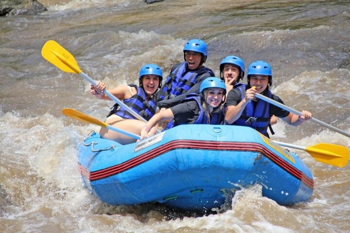 a group of people in a raft in the water