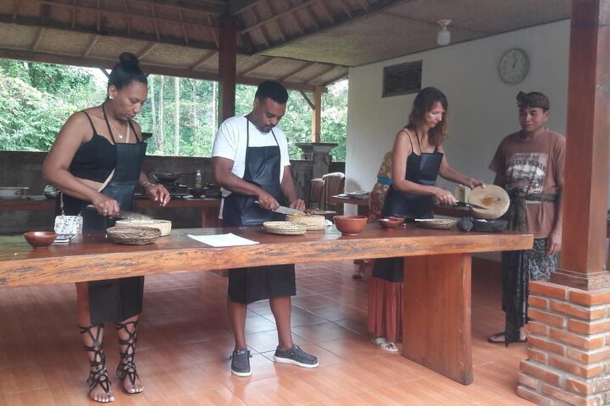 a group of people standing around a table preparing food