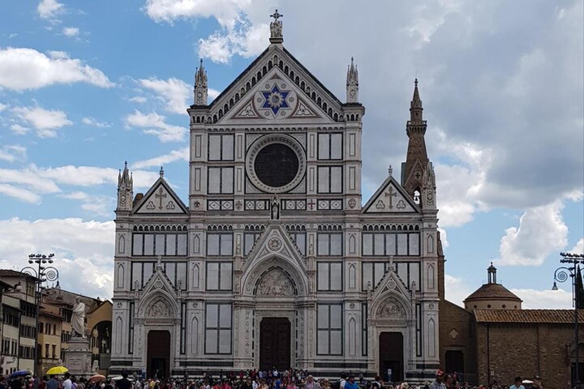 a large building with people standing in front of it