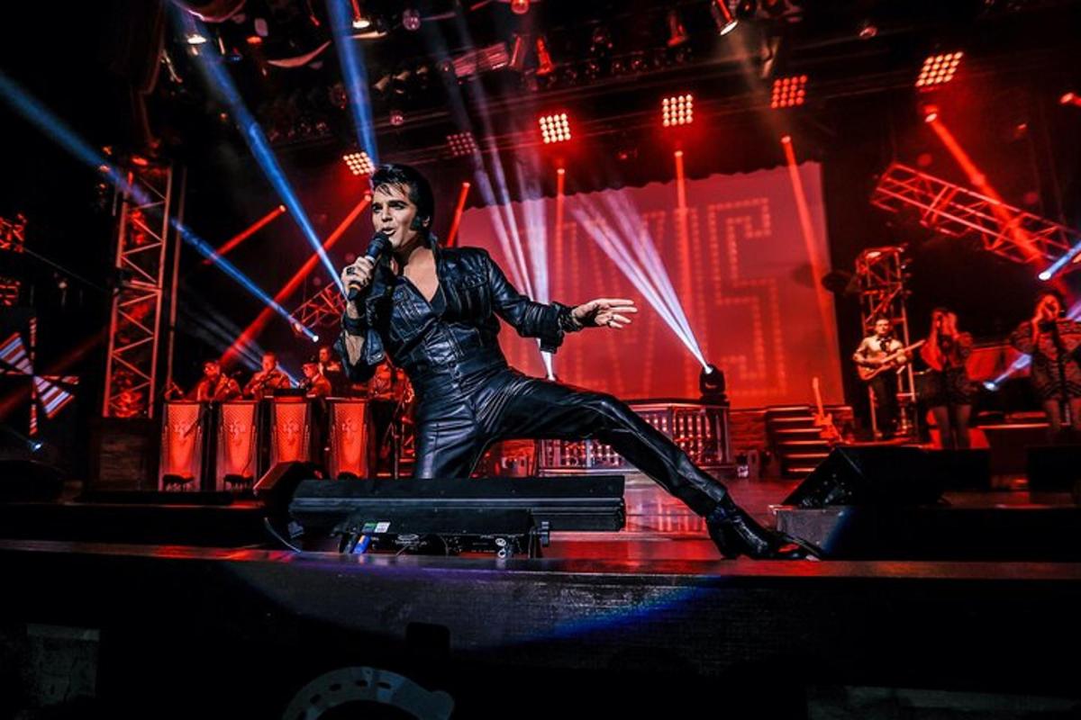 a woman standing on a stage with a microphone