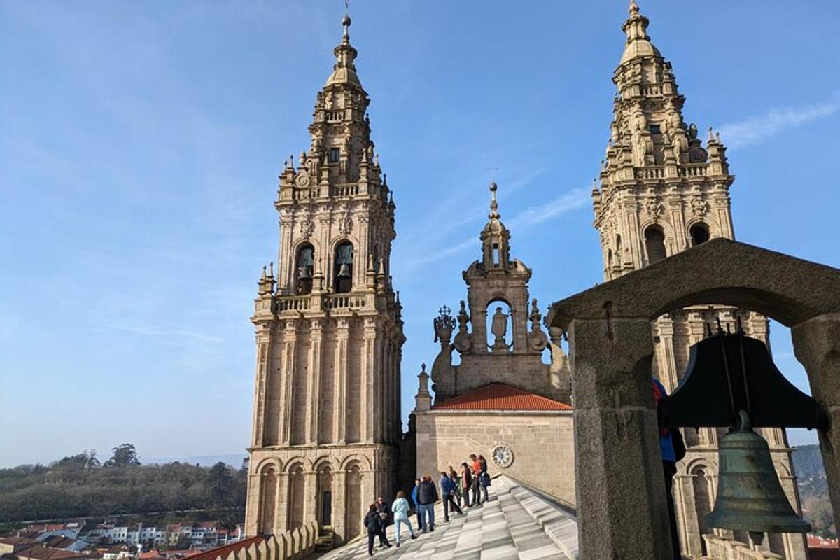 a group of people walking in front of two towers