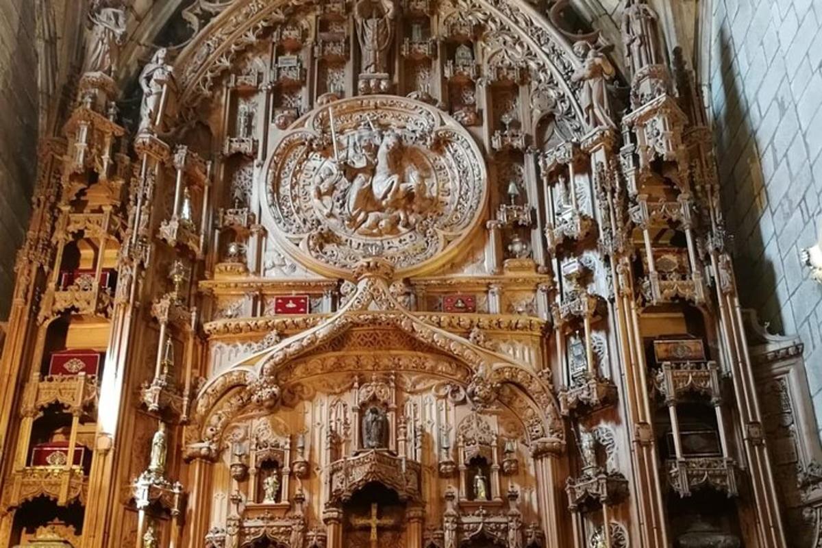an ornate church with a large wooden altar