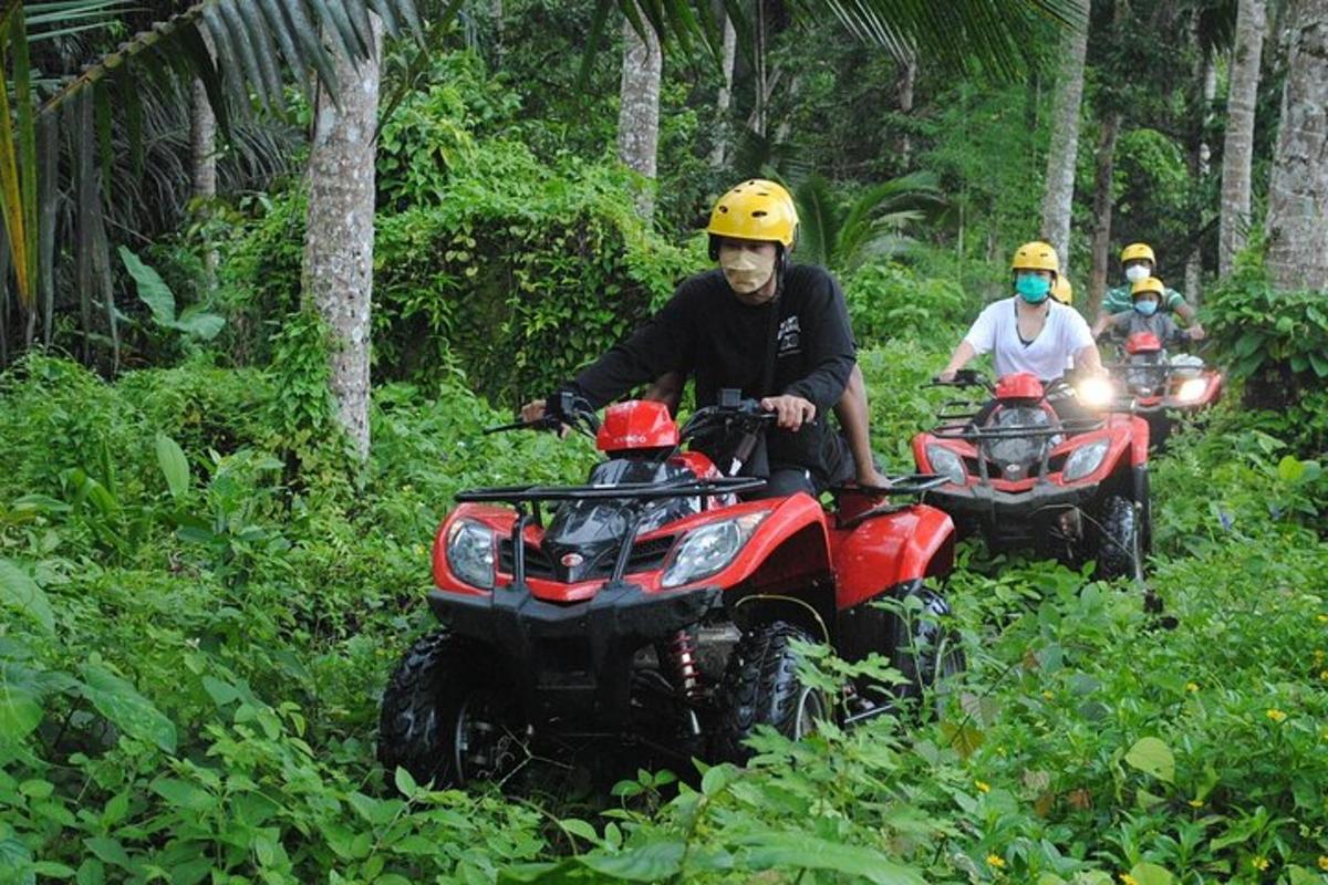 isang grupo ng mga taong nakasakay sa mga atv sa kagubatan