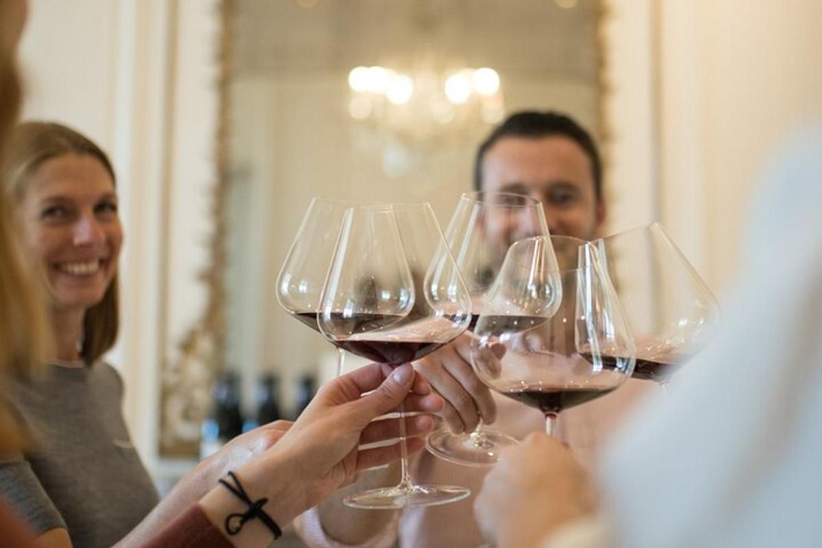a group of people holding up wine glasses