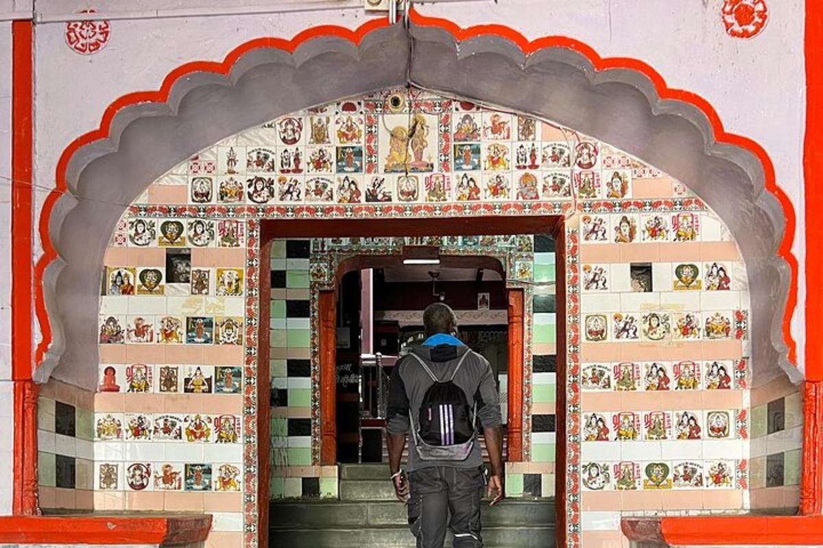 a man with a backpack walking into a building