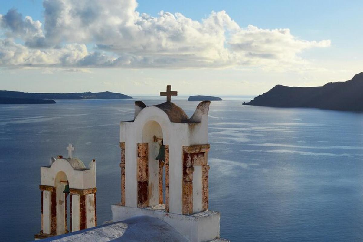 a church with a cross on top of the water