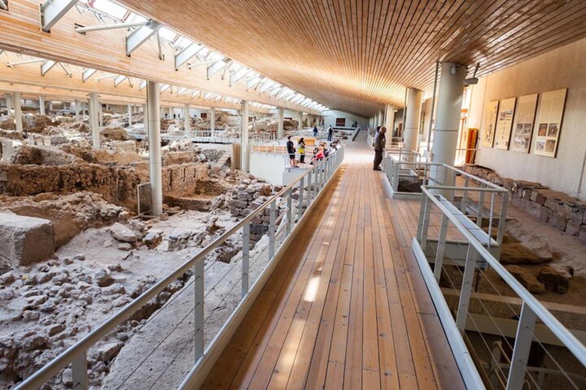a museum with people looking at animals in a building
