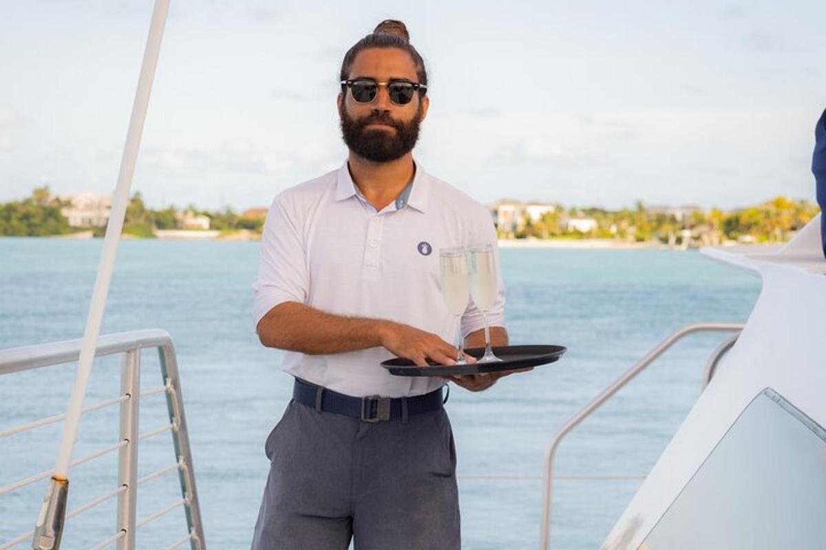 a man standing on a boat holding a laptop