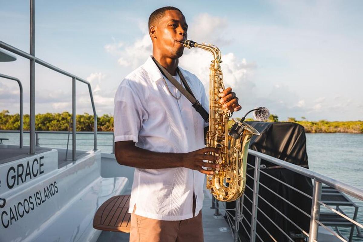 a man playing a saxophone on a boat