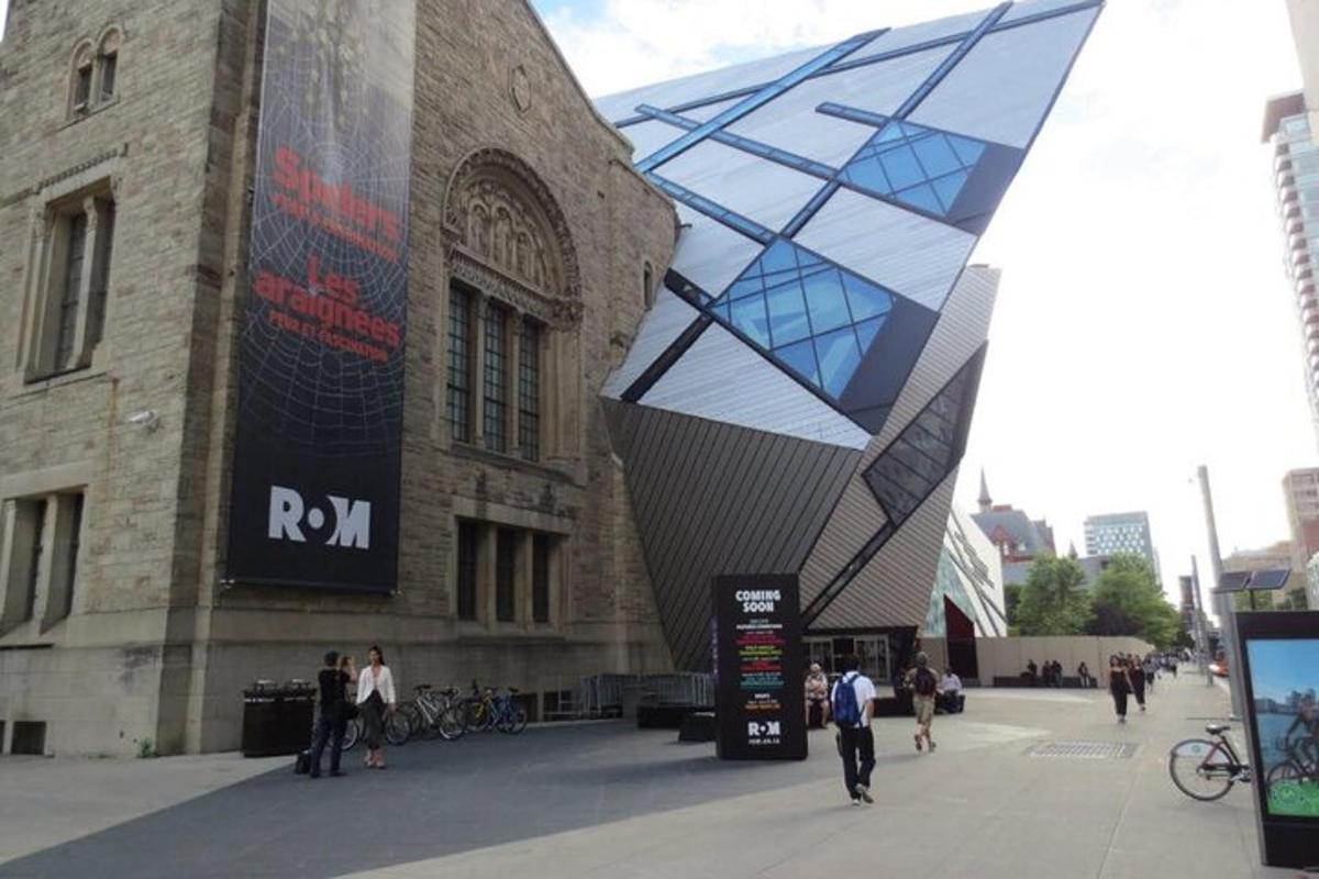a building with a large geometric structure in front of it