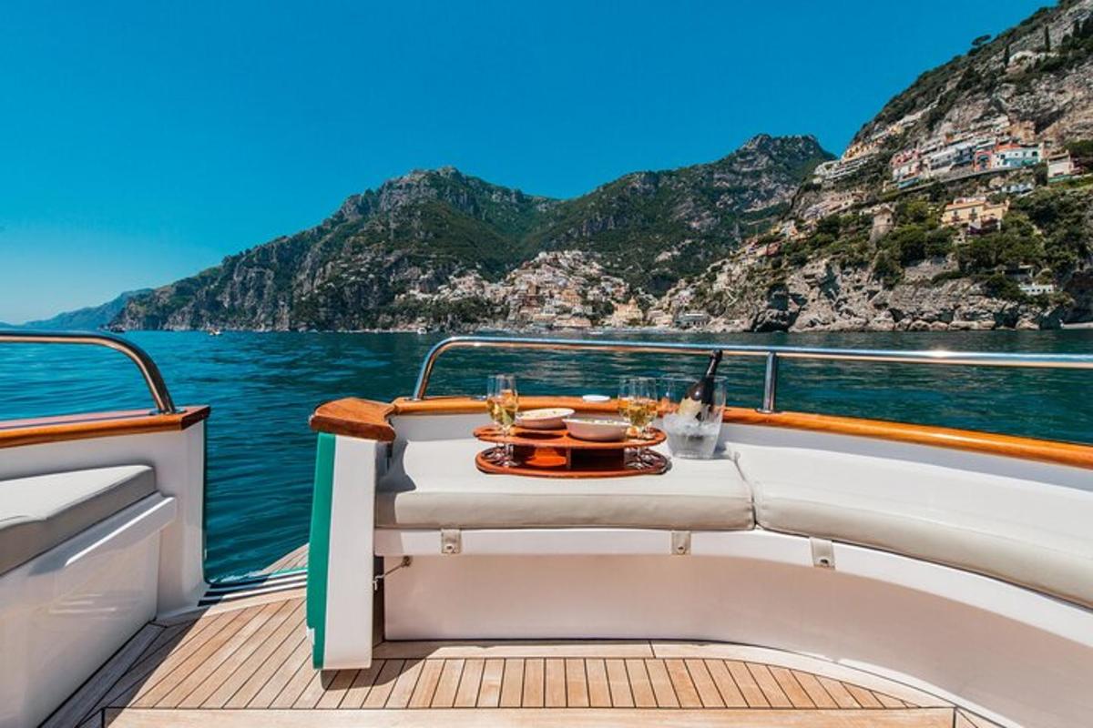 a table on the deck of a boat on the water