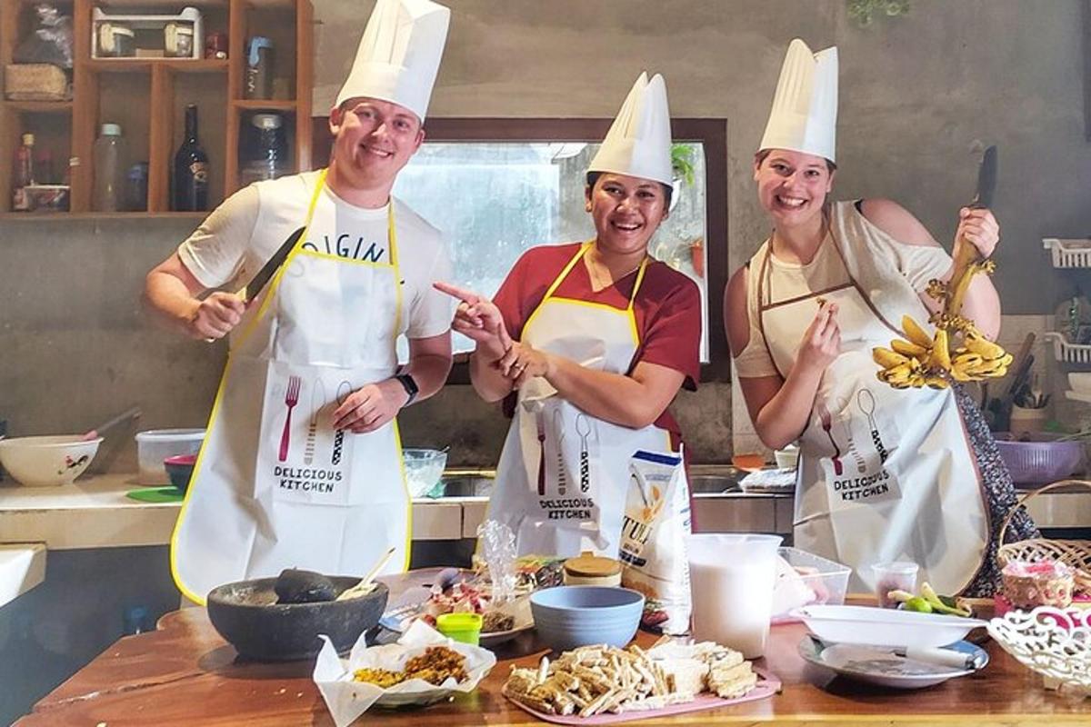 a group of three chefs standing in a kitchen