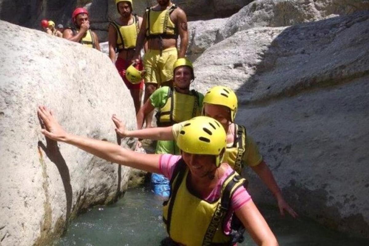 a group of people on a raft in the water