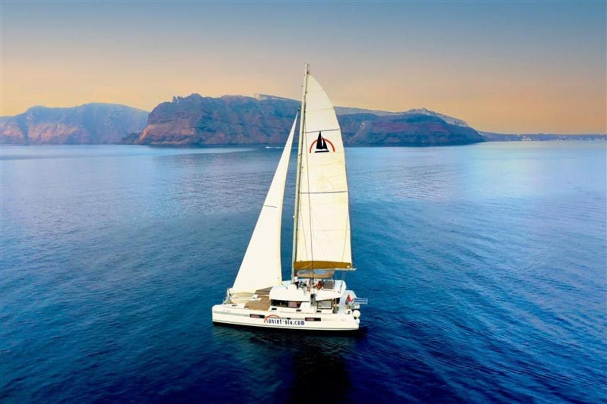 a white sailboat in the middle of the water