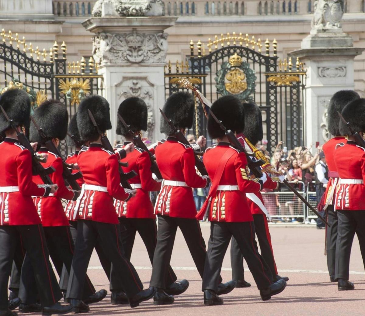 a group of women in red uniforms marching in a parade