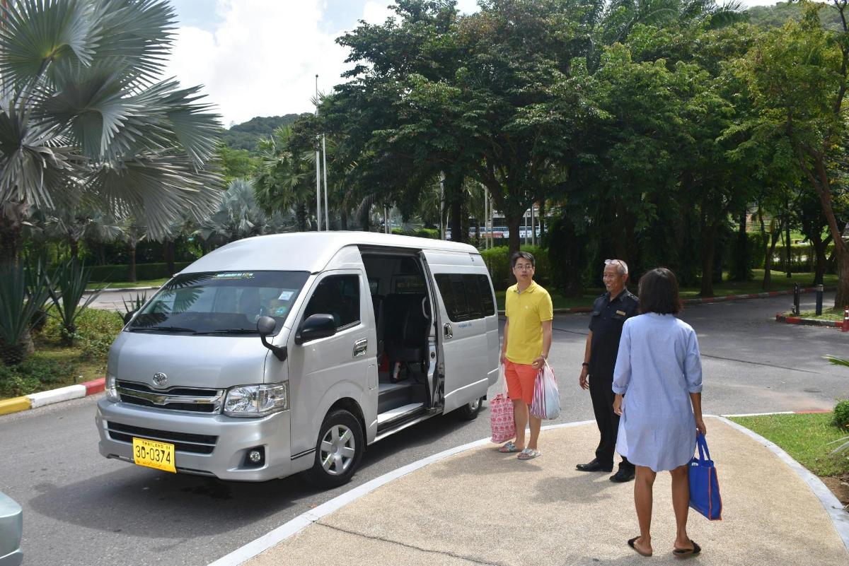 a group of people standing next to a van