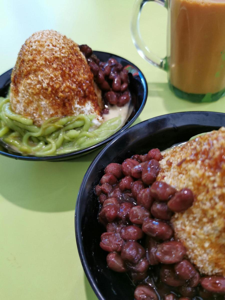 two plates of food with beans and a cup of coffee